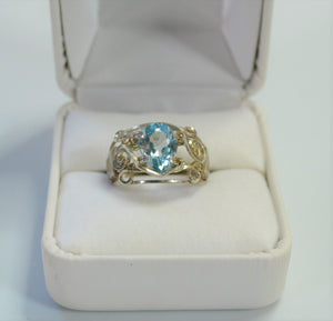 Front face view of pear shaped faceted Sky Blue Topaz ring